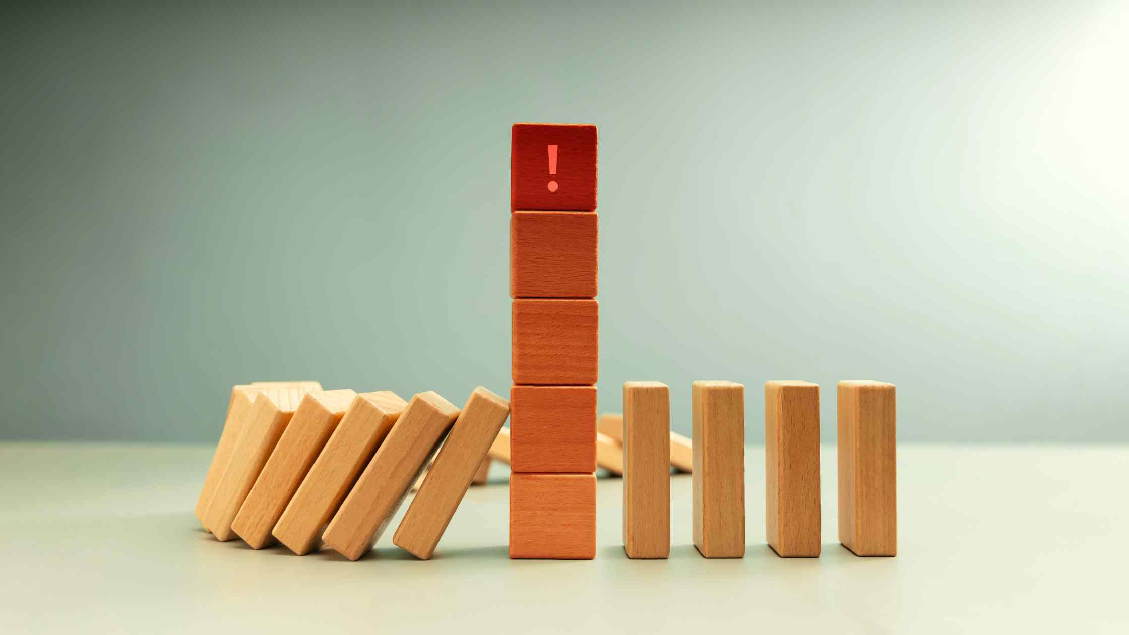 dominos-toppling-tower-of-red-alert-blocks