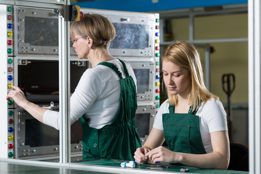 two-people-working-assembly-line